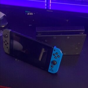 Nintendo Switch Console with Blue and Gray Joy-Con